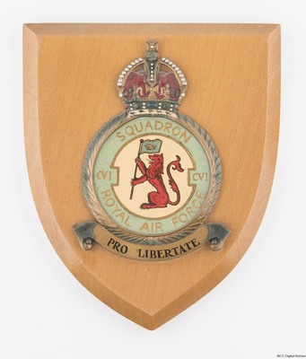 Colour image of a 106 Squadron crest mounted on a shield shaped wooden block