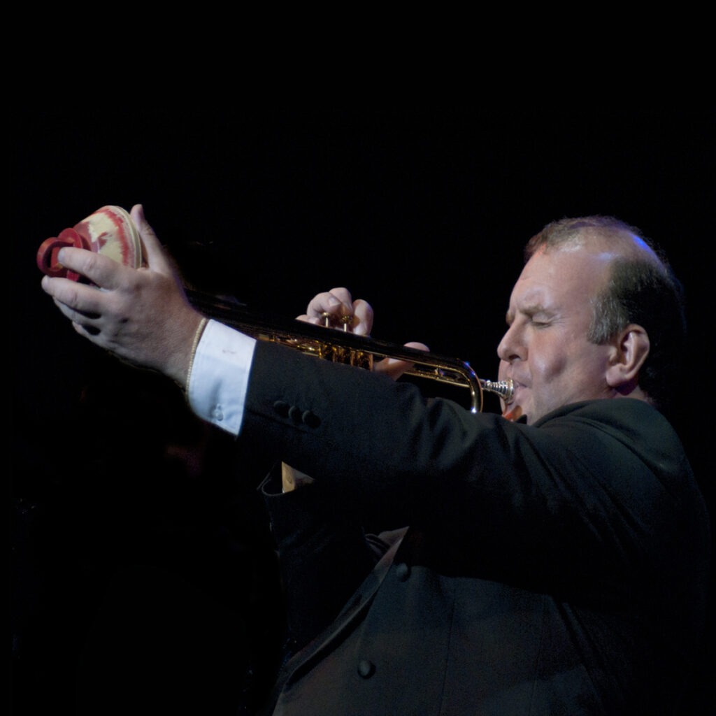 colour photo of a man playing a trumpet